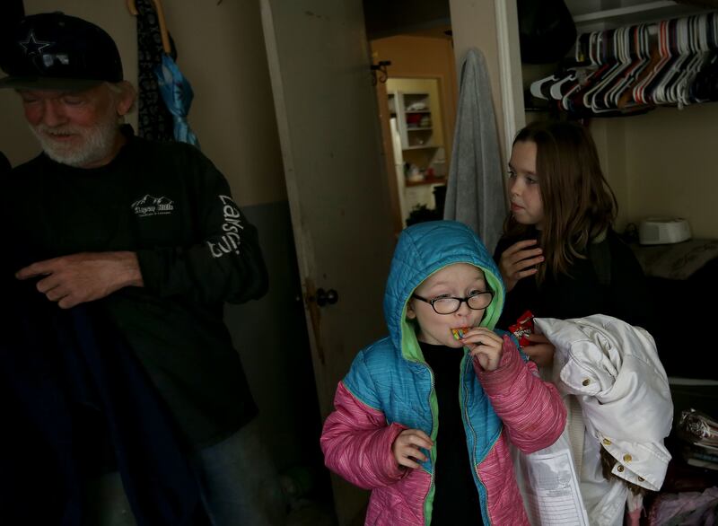 Lita Gardner, 7, eats Valentine's Day candy with sister Sara and father Robert Gardner at the Georgia Apartments in Salt Lake City on Thursday, Feb. 14, 2019. The Salt Lake City fire marshal has extended the 24-hour safety “fire watch” at the complex. Res