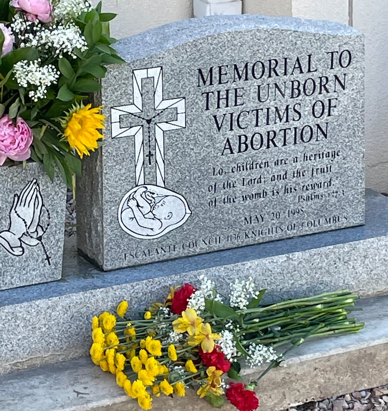 Flowers lie at a memorial to “unborn victims of abortion.”