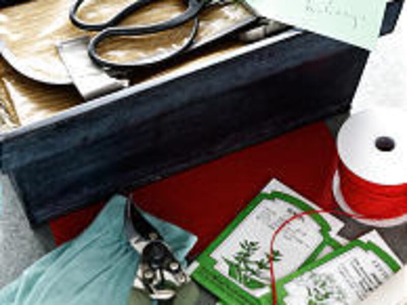 Include items such as shears, seeds, markers and gloves with a gardening apron gift box.
