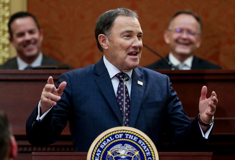 FILE - Utah Gov. Gary Herbert delivers his State of the State address at the Utah State Capitol, Wednesday, Jan. 30, 2019, in Salt Lake City. Behind Herbert are Speaker of the House Brad Wilson, left, R-Kaysville, and Senate President Stuart Adams, R-Layt