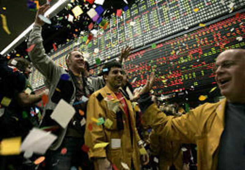 Clerks and traders celebrate the close of business on the final trading day in the S\&P 500 trading pit Friday in Chicago.