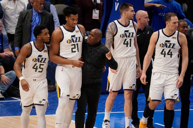 Utah Jazz’s Hassan Whiteside (21) is escorted off the court after he was ejected after a foul against Dallas’ Luka Doncic.