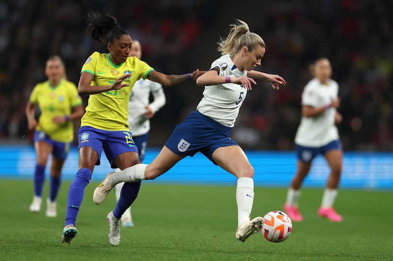 England’s Leah Williamson is challenged by Brazil’s Kerolin during the Women’s Finalissima soccer match between England and Brazil.