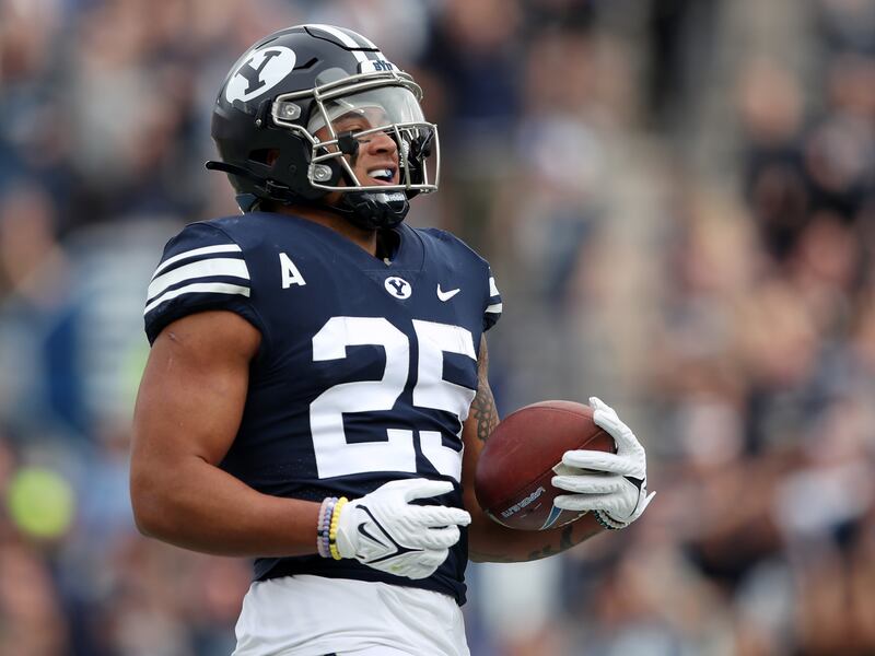 BYU’s Tyler Allgeier smiles as he scores a touchdown during a game against Idaho State at LaVell Edwards Stadium in Provo.
