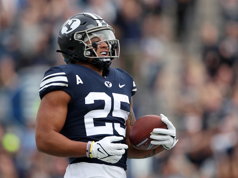 BYU’s Tyler Allgeier smiles as he scores a touchdown during a game against Idaho State at LaVell Edwards Stadium in Provo.