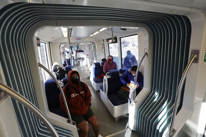 TRAX riders take a train during Free Fare February in Salt Lake City on Tuesday, Feb. 1, 2022.