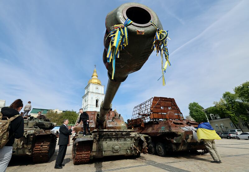 People come to look at an exhibition displaying destroyed Russian military vehicles in central Kyiv, Ukraine,