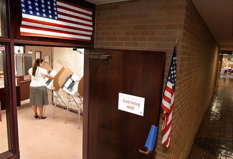 County employee Angelina Harward votes early in the municipal elections in the county clerks office in Salt Lake City, UT August 31, 2009. Keith Johnson, Deseret News