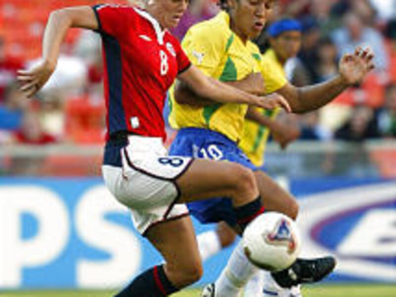 Norway's Solveig Gulbrandsen (8) and Brazil's Daniela battle for the ball in the first half of their match, which Norway won 4-1 Wednesday.