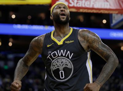 Golden State Warriors' DeMarcus Cousins celebrates a score against the San Antonio Spurs during the second half of an NBA basketball game Wednesday, Feb. 6, 2019, in Oakland, Calif. (AP Photo/Ben Margot)