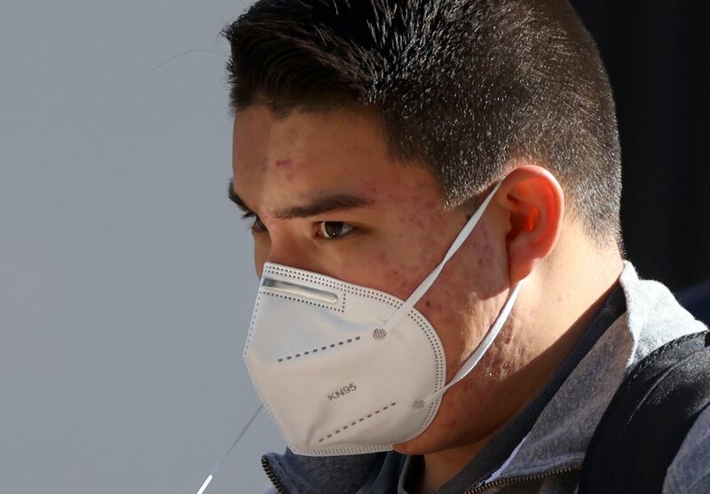 Santiago Cruz wears a KN95 mask in downtown Salt Lake City on Jan. 26, 2022.