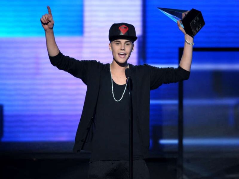 On Nov. 18, Justin Bieber accepts the award for favorite album, pop/rock, “Believe,” at the 40th American Music Awards in Los Angeles.