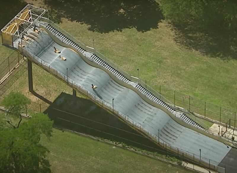 Children go down the slide at Belle Isle Park in Detroit.