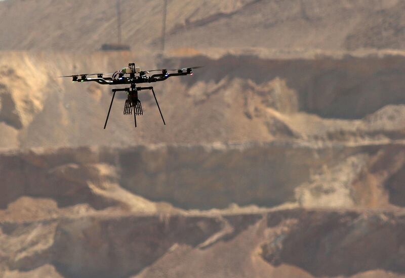 A DroneFleet drone flies a test run over Rio Tinto Kennecott’s Bingham Canyon Mine on Thursday, April 7, 2016. Drones are being used in some areas to monitor COVID-19.