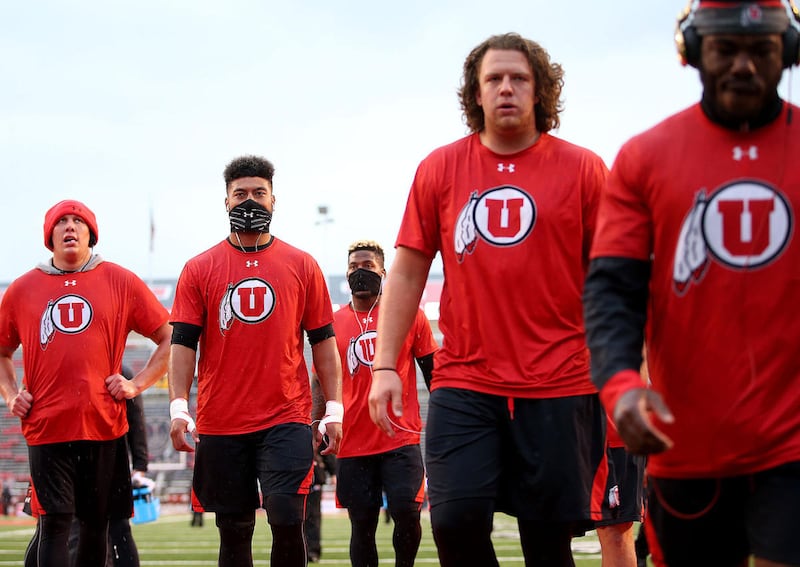 The Utes finish warming up prior to the Utah vs. USC NCAA football game at Rice-Eccles Stadium in Salt Lake City on Friday, Sept. 23, 2016.