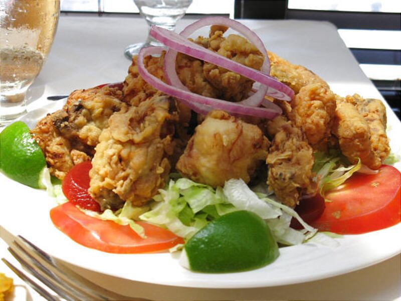 When photographing food, such as the Latin fried chicken dish known as chicharrones de pollo, get up close and at a low angle.