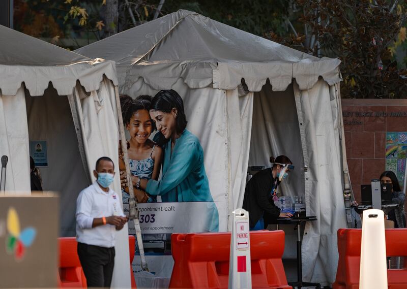 In this Dec. 18, 2020, file photo, medical tents for vaccinations are set outside the Children’s Hospital Los Angeles. While shipments of the vaccine are rolling out to many health care workers and nursing homes across the country, it could be months before it’s available for the general public.