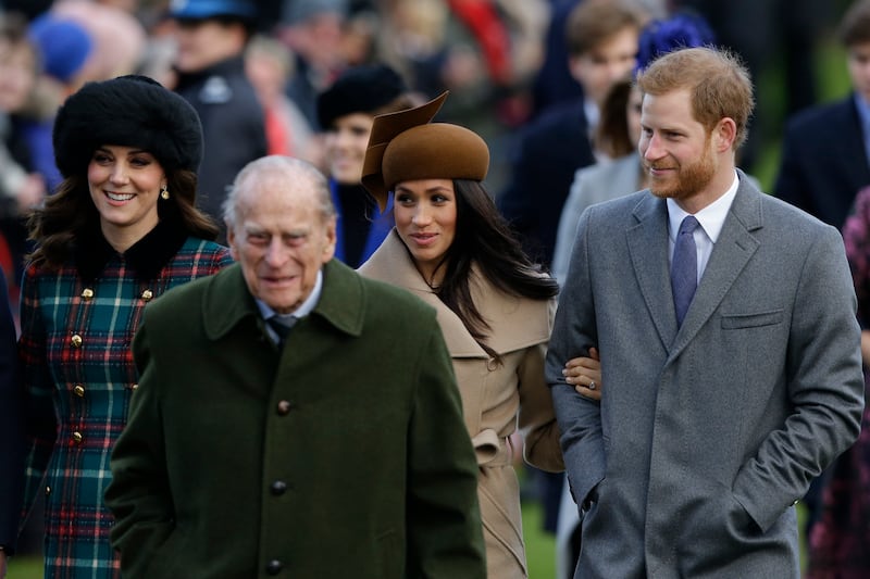 In this Dec. 25, 2017 file photo from left, Kate, Duchess of Cambridge, Prince Philip, Meghan Markle, and Prince Harry arrive to the traditional Christmas Days service, at St. Mary Magdalene Church in Sandringham, England.