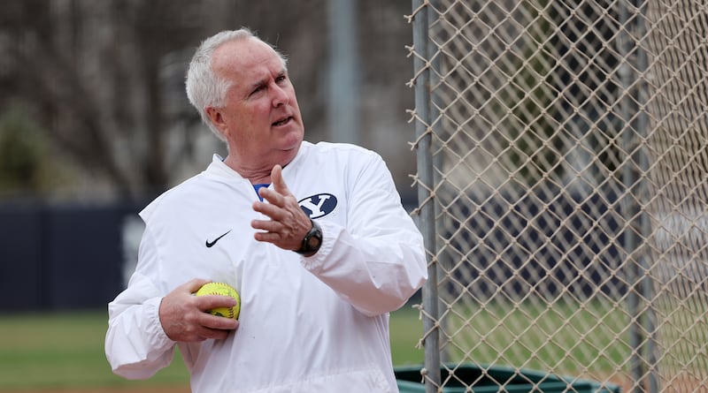 BYU softball coach Gordon Eakin gives a few directions during batting practice on Monday, March 28, 2022.