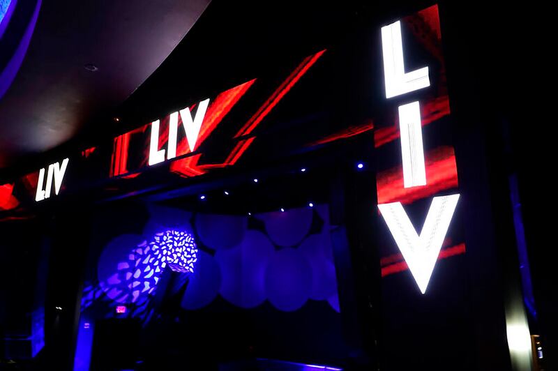 Lights are illuminated at an empty LIV nightclub Wednesday, Oct. 14, 2020, in Miami Beach, Fla.