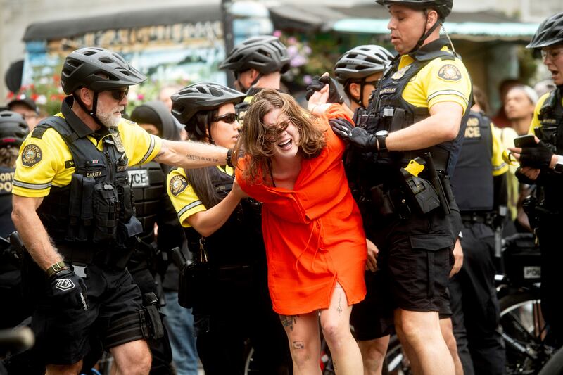 Police officers detain a protester against right-wing demonstrators following an “End Domestic Terrorism” rally in Portland, Ore., on Saturday, Aug. 17, 2019. Although the main protest remained largely peaceful, some skirmishes erupted in the following ho