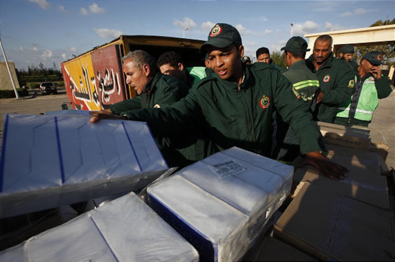 Volunteer paramedics load donated medical supplies onto a Palestinian truck at the Egyptian border crossing terminal in Rafah, Egypt. Egypt took in a trickle of wounded Palestinians from the Gaza Strip.