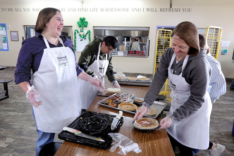 Stacia Walker, Luis Martinez and Cheryl Leithead volunteer at St. Vincent de Paul Dining Hall in Salt Lake City on Thursday, March 7, 2019. Walker and Leithead learned about the volunteer opportunity through a sign-up sheet at the Murray 33rd Ward for The