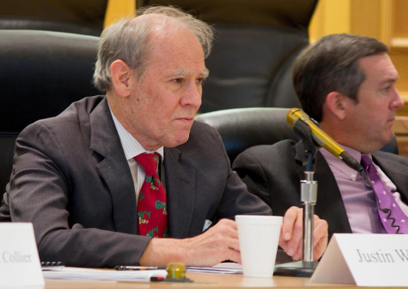 Comptroller Justin Wilson, left, attends a meeting of the State Funding Board in Nashville, Tenn., in Friday, Dec. 9, 2011. Wilson is calling on the Tennessee Education Department to overhaul what he calls the state's overly complex school funding formula