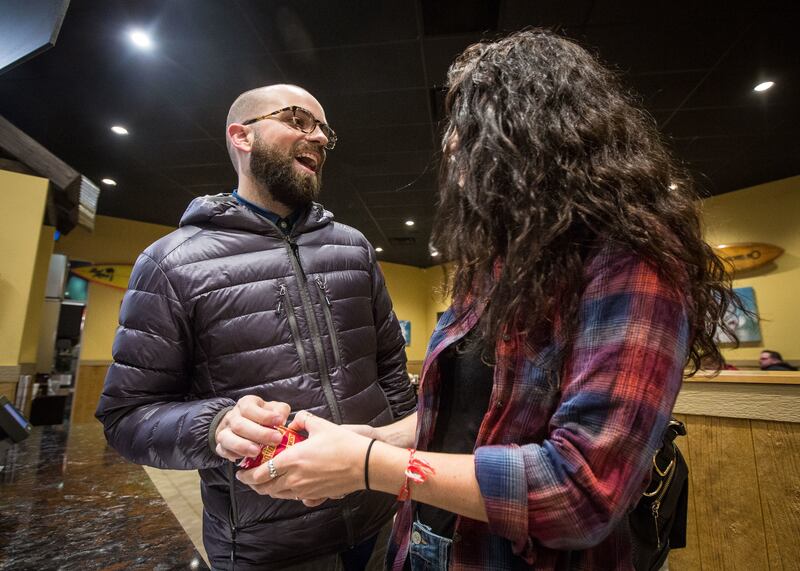 Parker Wilson, left, and Paige Eastwood talk to each other about the beverage during a dinner date at Mo' Bettahs in Lehi on Thursday, Nov. 15, 2018.