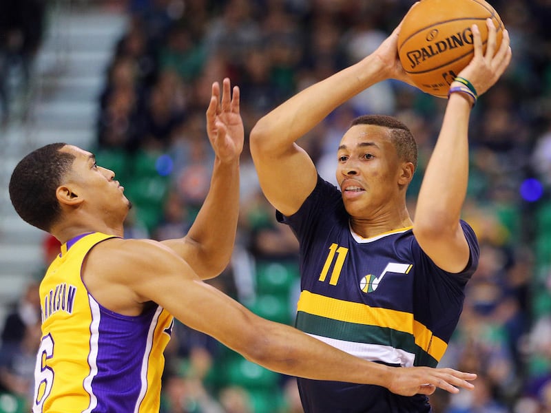 Utah Jazz guard Dante Exum (11) is defended by Los Angeles Lakers guard Jordan Clarkson (6) as the Utah Jazz open the home season with the LA Lakers in Salt Lake City on Friday, Oct. 28, 2016.