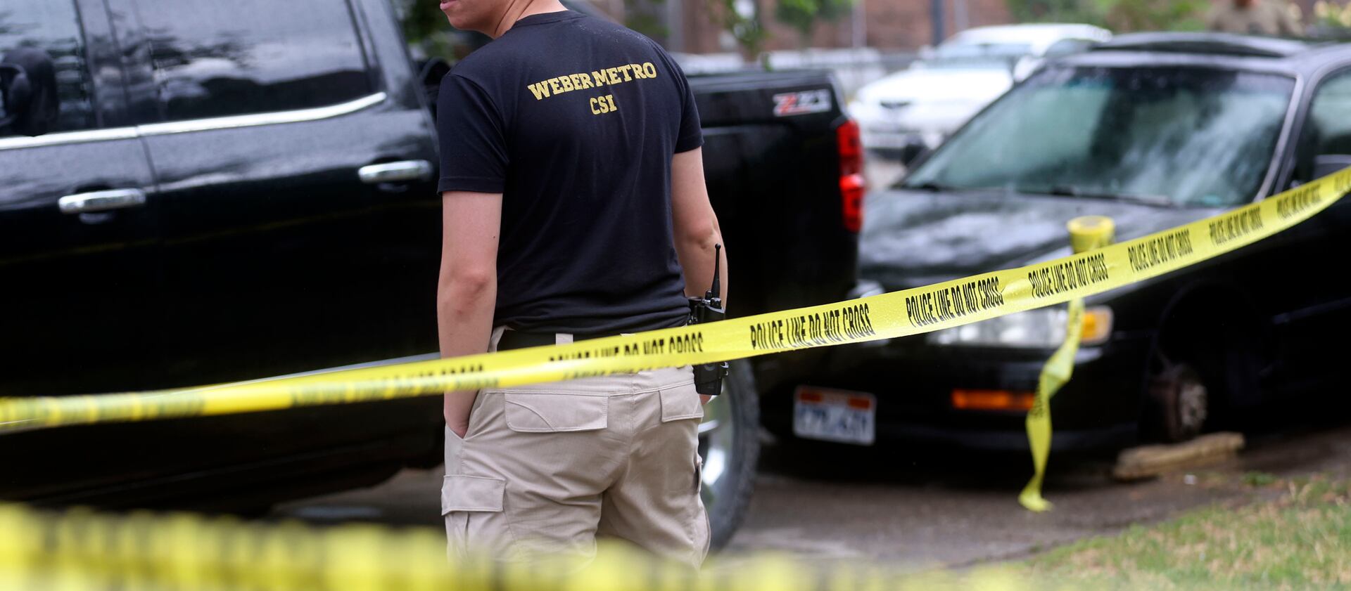 Weber Metro crime scene investigators works at the scene of a shooting on Monroe Boulevard in Ogden.