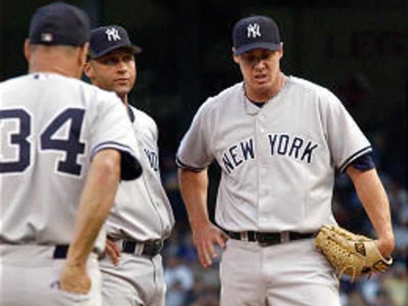 Yankees pitcher Tanyon Sturtze, right, began serving his three-game suspension Thursday night for his involvement in the July 24th scuffle with Boston.