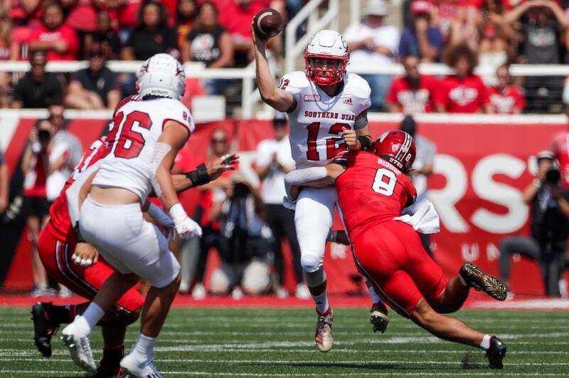 Utah safety Cole Bishop (8) tackles SUU QB Justin Miller in Salt Lake City on Saturday, Sept. 10, 2022.