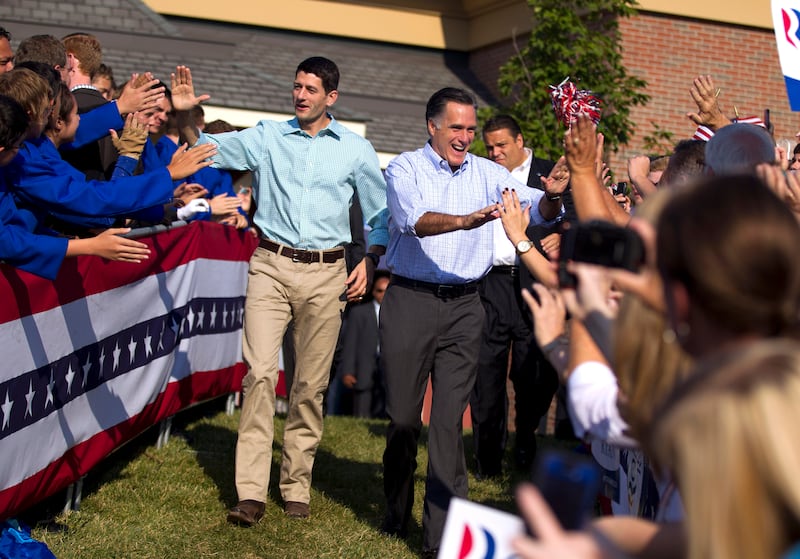 FILE - In this Aug. 25, 2012 file photo, Republican presidential candidate, former Massachusetts Gov. Mitt Romney and his vice presidential running mate Rep. Paul Ryan, R-Wis., arrive for a campaign rally in Powell, Ohio. They're the political world's new