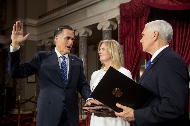Vice President Mike Pence administers the Senate oath of office Mitt Romney in a mock ceremony in in 2019.