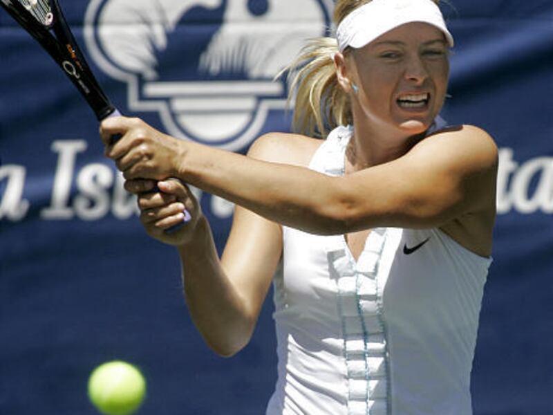 Maria Sharapova returns a shot to Dominika Cibulkova during her win Sunday.
