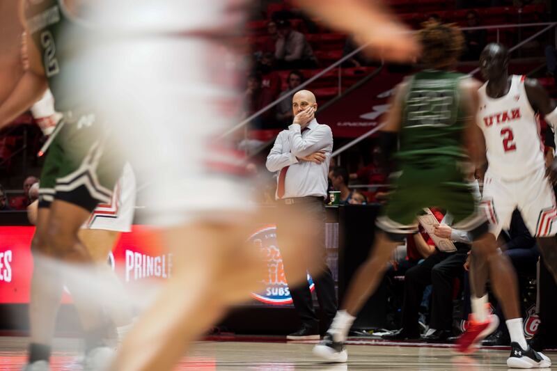 Utah head coach Craig Smith watches the game against Manhattan at the Huntsman Center in Salt Lake City on Dec. 11, 2021.