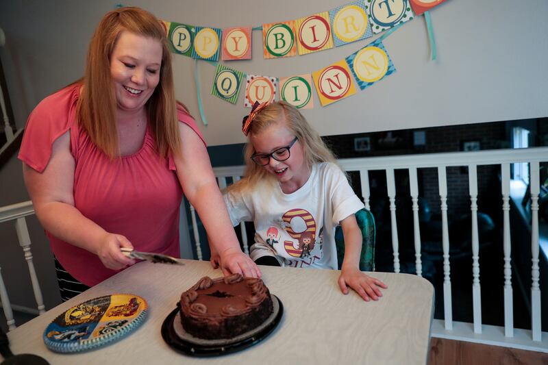 Jessica Sellers and her daughter, Quinn, get ready to eat cake for Quinn's ninth birthday at their home in Taylorsville, Utah, on Tuesday, May 14, 2019. Quinn was a so-called "micropreemie" when she was born at just 25 weeks.