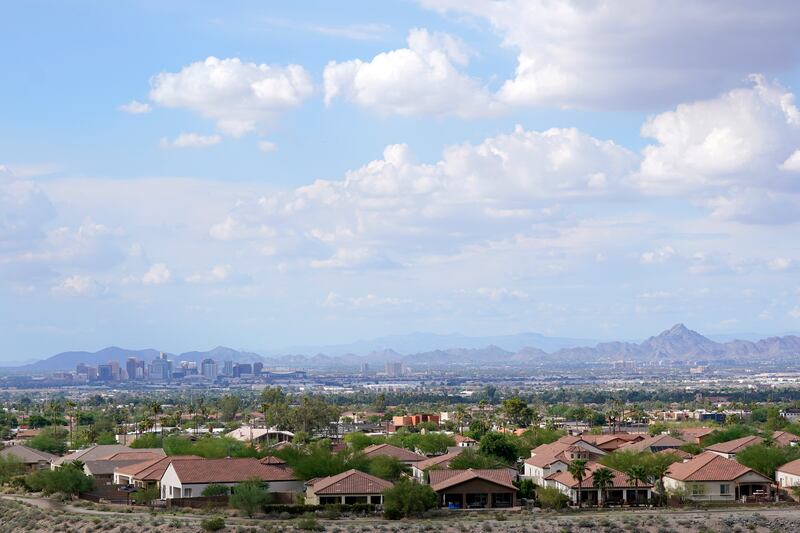 With the downtown skyline in the background, expansive urban sprawl continues to grow in Phoenix.