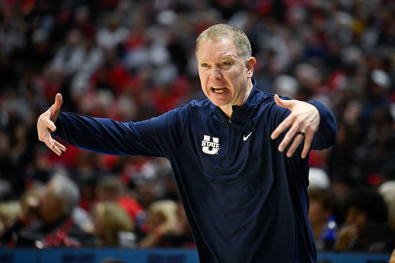 Utah State head coach Jerrod Calhoun yells from the sideline during the game against San Diego State, Saturday, Dec. 28, 2024, in San Diego. The first-year Aggies coach has USU off to a 15-1 start.