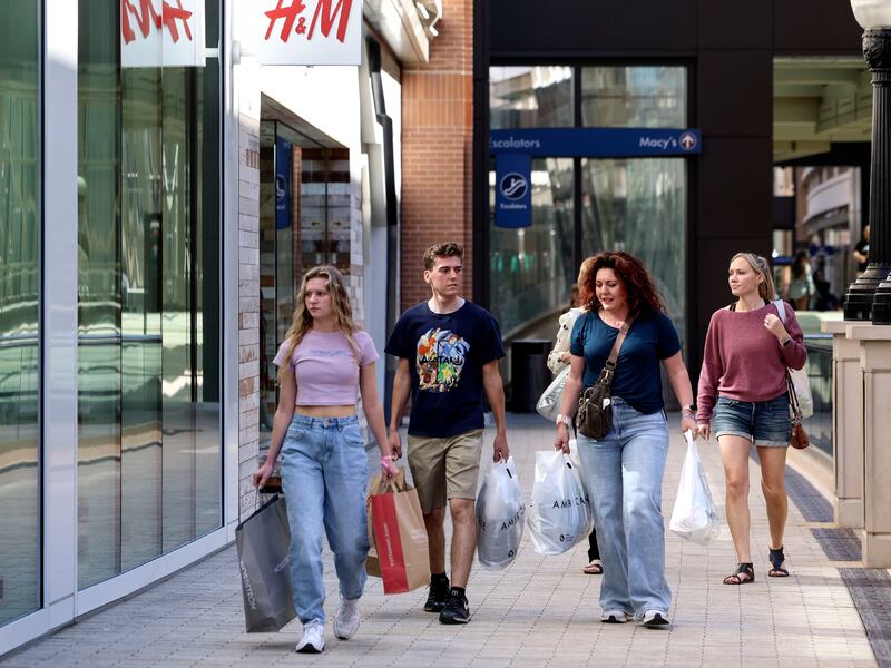 Londyn, Logan and Michelle Bishop, of Stansbury Park, shop at City Creek Center in Salt Lake City on Thursday, Oct. 20, 2022.