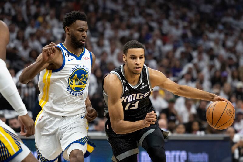 Golden State Warriors forward Andrew Wiggins defends Sacramento Kings forward Keegan Murray, Sunday, April 30, 2023.