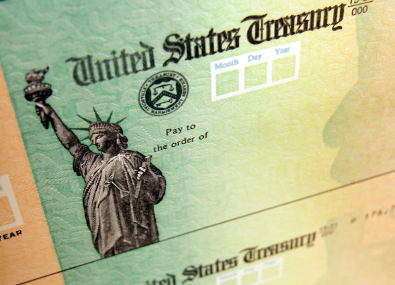 Blank United States Treasury checks are shown on an idle press at the Philadelphia Regional Financial Center.