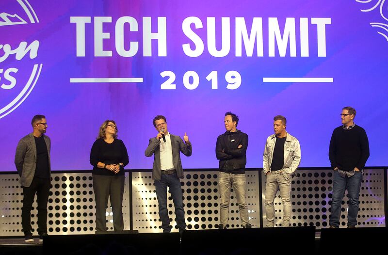 Pluralsight CEO Aaron Skonnard, Banyan CEO Carine Clark, Domo CEO Josh James, Qualtrics CEO Ryan Smith, Vivint CEO Todd Pedersen and InsideSales CEO Dave Elkington take the stage during the Silicon Slopes Tech Summit at the Salt Palace Convention Center i