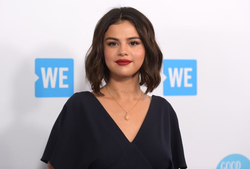 Selena Gomez arrives at WE Day California on April 19, 2018, in Inglewood, Calif. Gomez is taking the heat in the kitchen. The singer-actress slices and dices in “Selena + Chef,” debuting Aug. 13 on the new HBO Max streaming service.