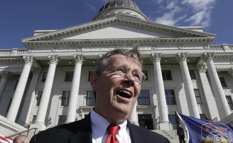 Former Utah Gov. Mike Leavitt speaks with reporters near the steps of the Utah State Capitol in this Wednesday, Sept. 18, 2013 file photo, in Salt Lake City. A group of prominent Republicans led by Leavitt have taken a key step on their campaign to revolu