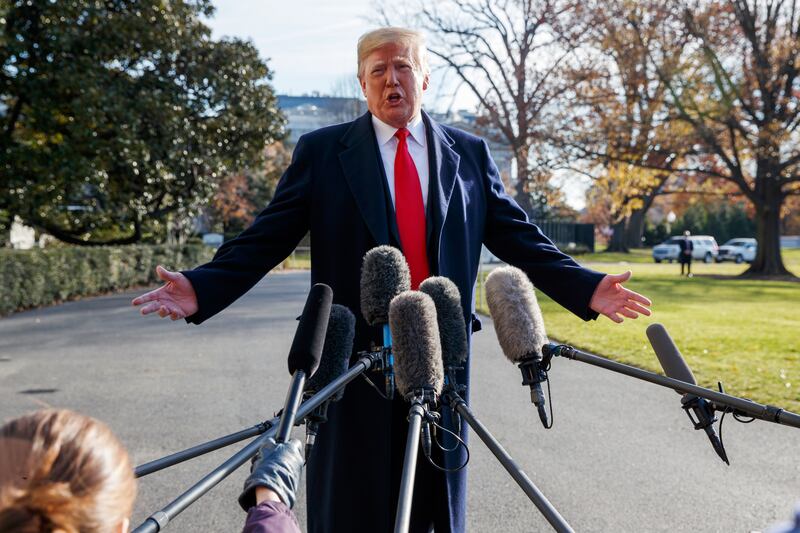 In this Dec. 7, 2018, file photo, President Donald Trump announces that he is nominating William Barr as his Attorney General, on the South Lawn of the White House, in Washington. Barr, once questioned the effectiveness of a border wall similar to the one