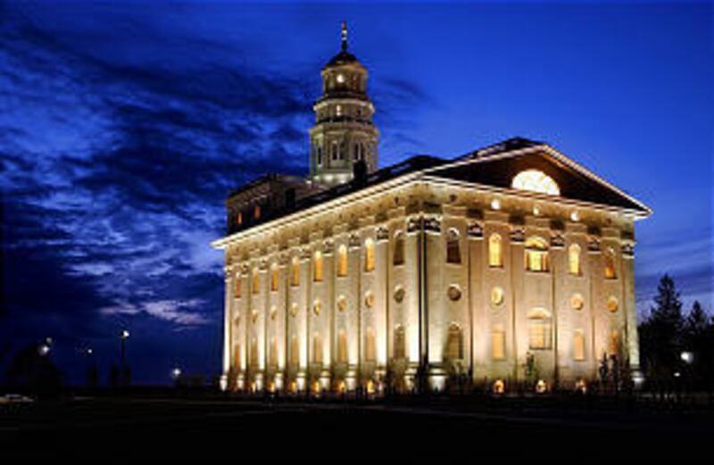 The temple, rebuilt by the church in 2002, stands tall above the small tourist town of Nauvoo, Ill.