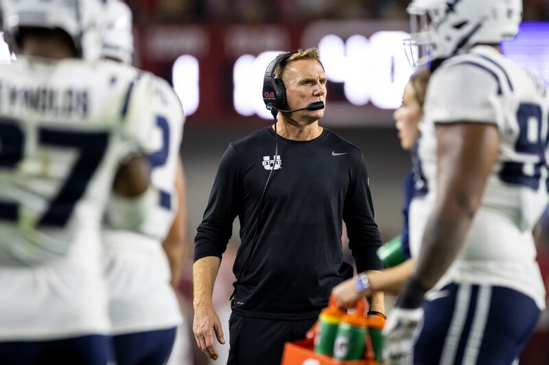 Utah State head coach Blake Anderson checks a call during a game against Alabama, Sept. 3, 2022, in Tuscaloosa, Ala.
