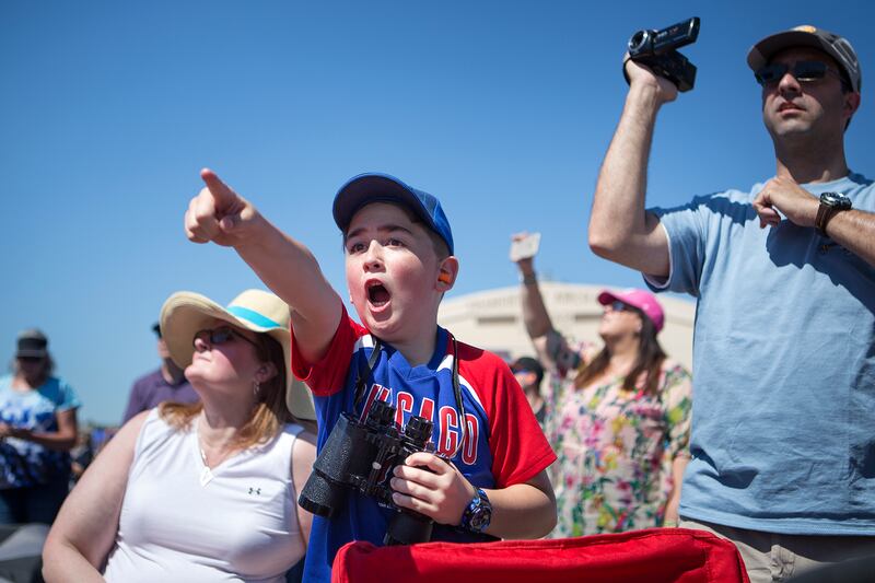 Gavry Strelka, 9, watches the 388th Fighter Wing Attack Demo streak by in F-35As during the Warriors Over the Wasatch Air and Space Show at Hill Air Force Base on Saturday, June 23, 2018. Watching behind him are Mark and Carrie Strelka.